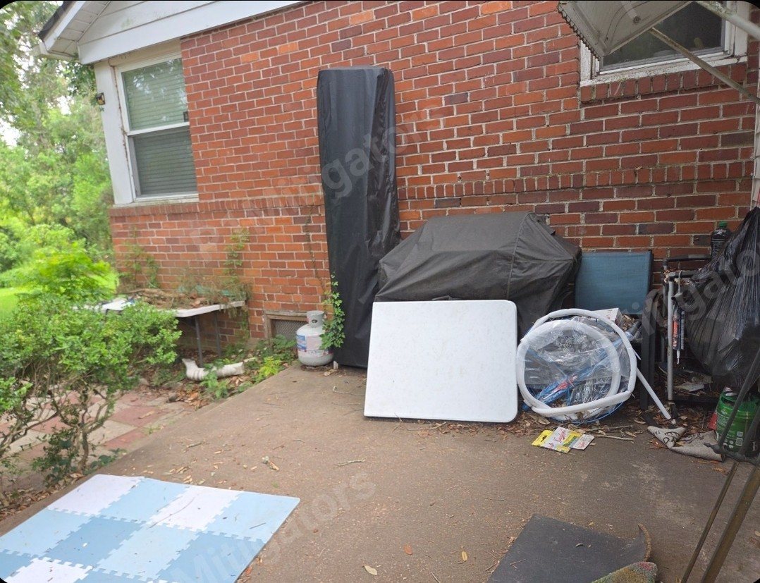 Deck project before — Junk-filled backyard turned into a finished deck ready for entertaining — Jacksonville FL by P1Mitigators