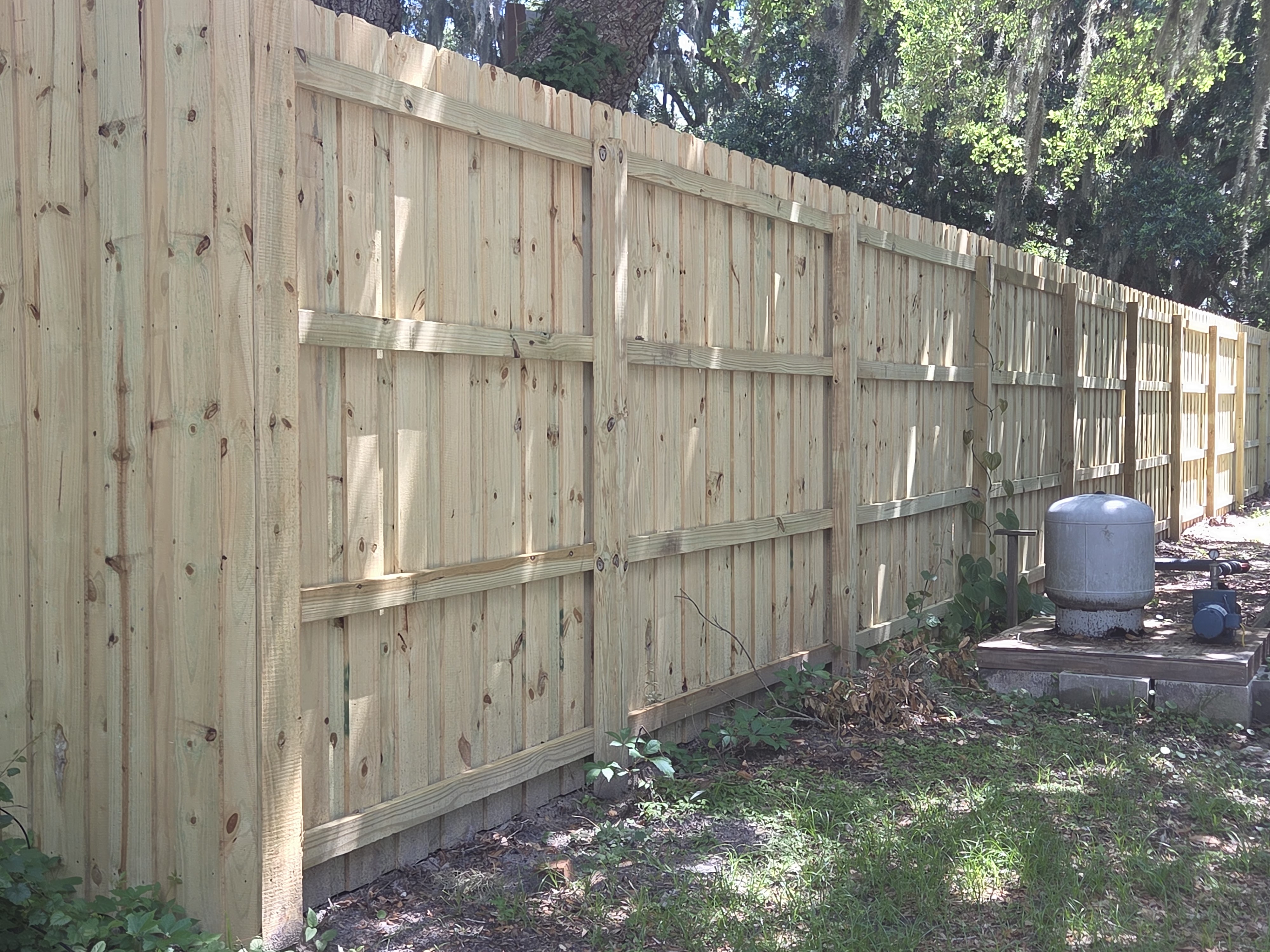 8-foot board on board fence back side — three-rail construction with horizontal runners Jacksonville FL