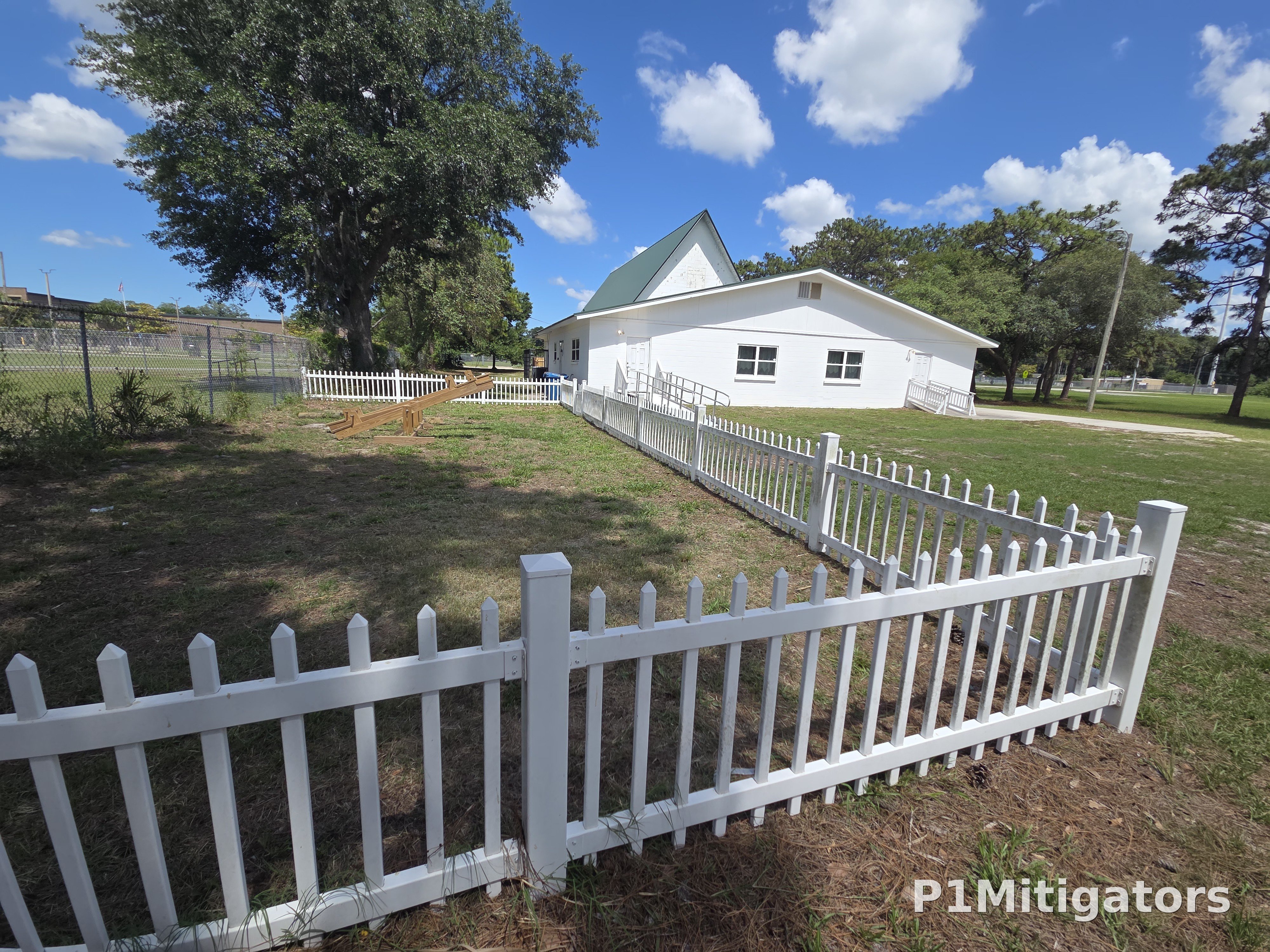 White Picket Fencing project photo 2 by P1Mitigators Jacksonville FL