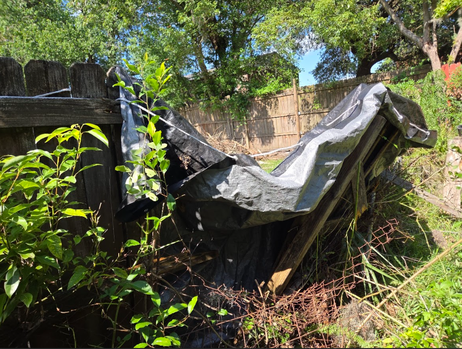 Fence damage before repair photo 2 — P1Mitigators Jacksonville FL