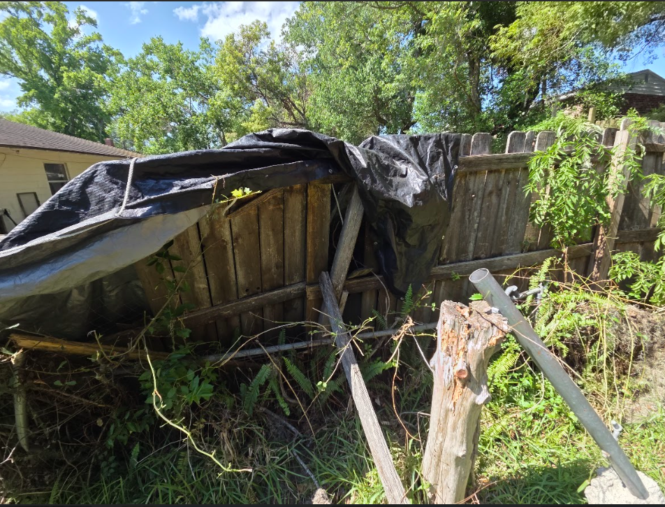 Fence damage before repair photo 1 — P1Mitigators Jacksonville FL