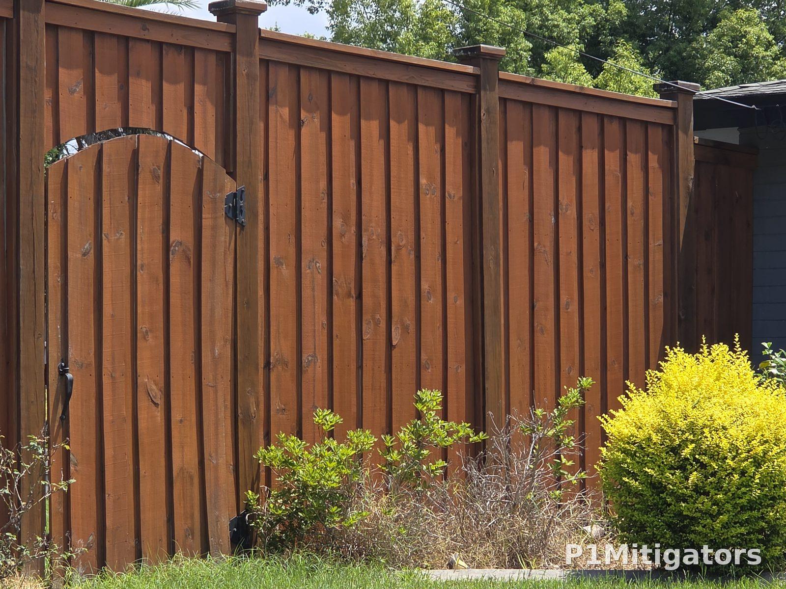 Stained Wood Fencing project photo 2 by P1Mitigators Jacksonville FL