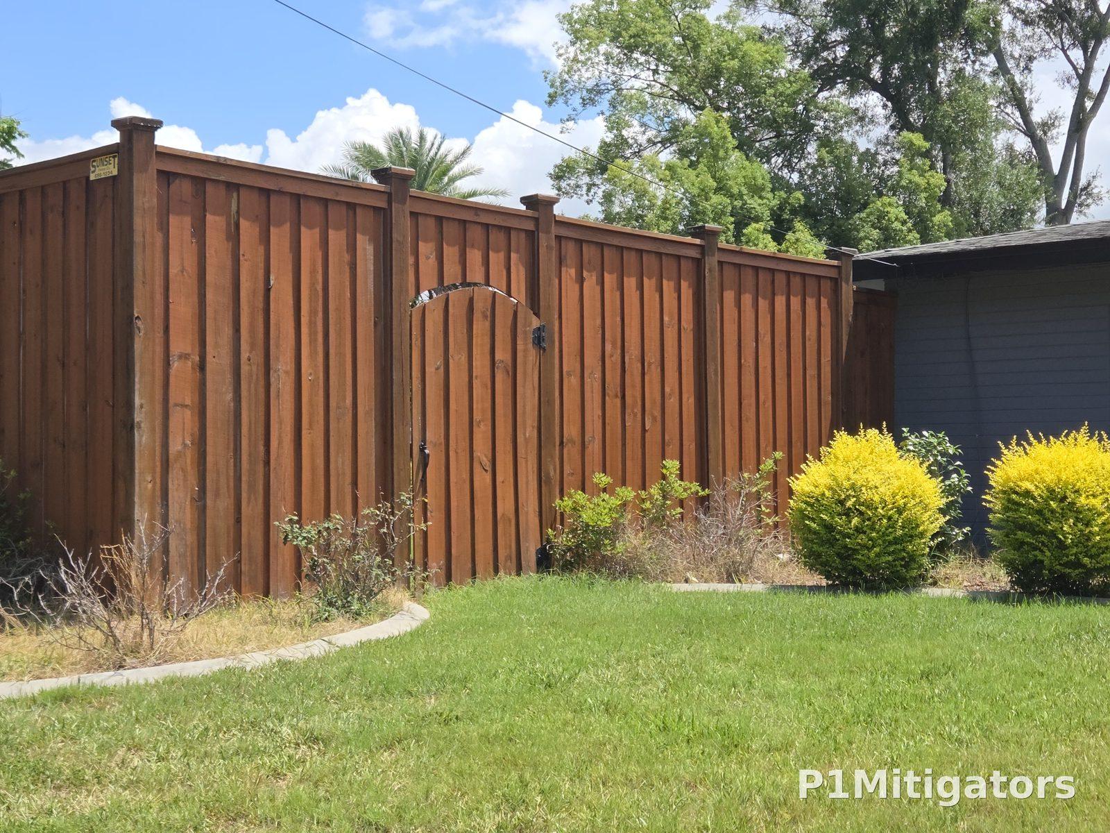 Stained Wood Fencing project photo 3 by P1Mitigators Jacksonville FL