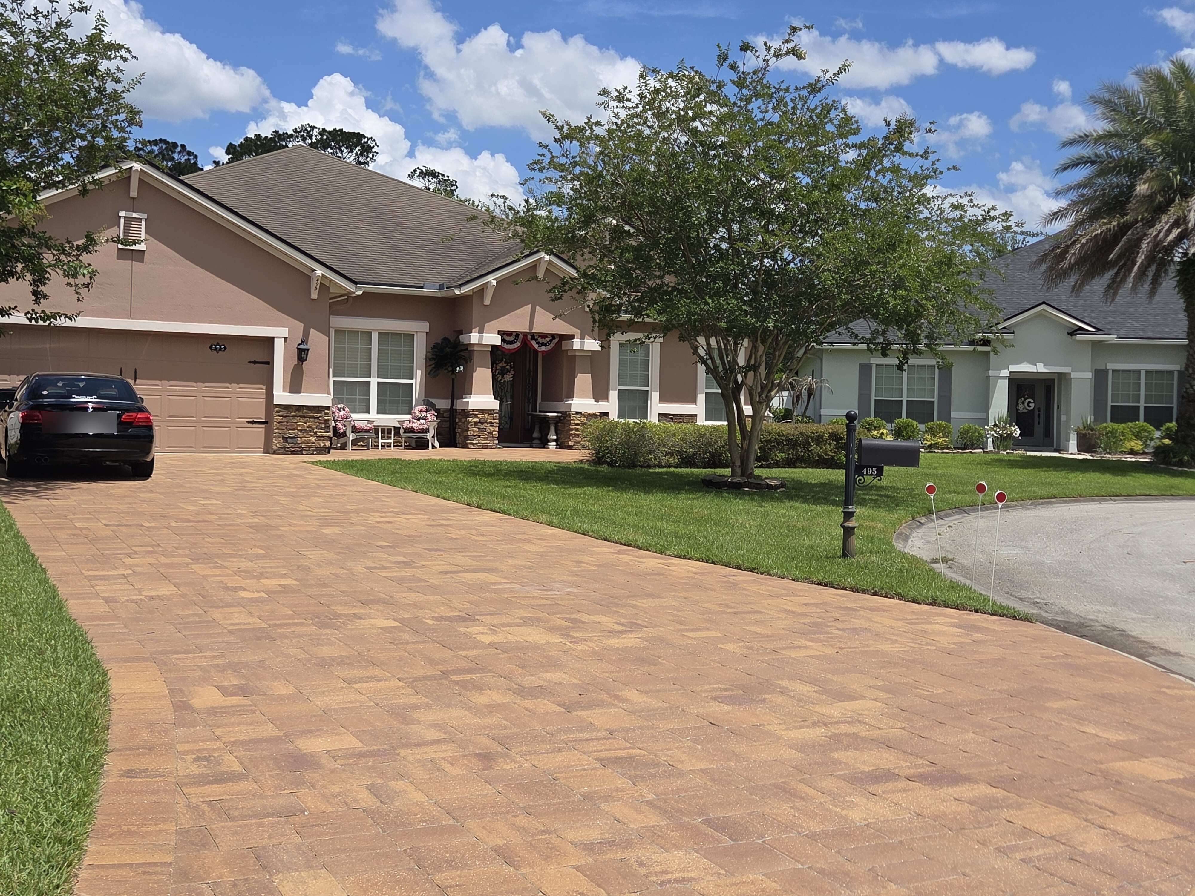 Brick paver driveway front view — finished herringbone pattern