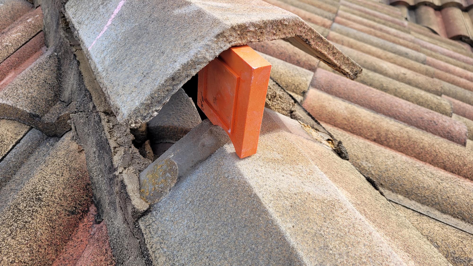 Storm-damaged tile roof measured for an insurance claim estimate